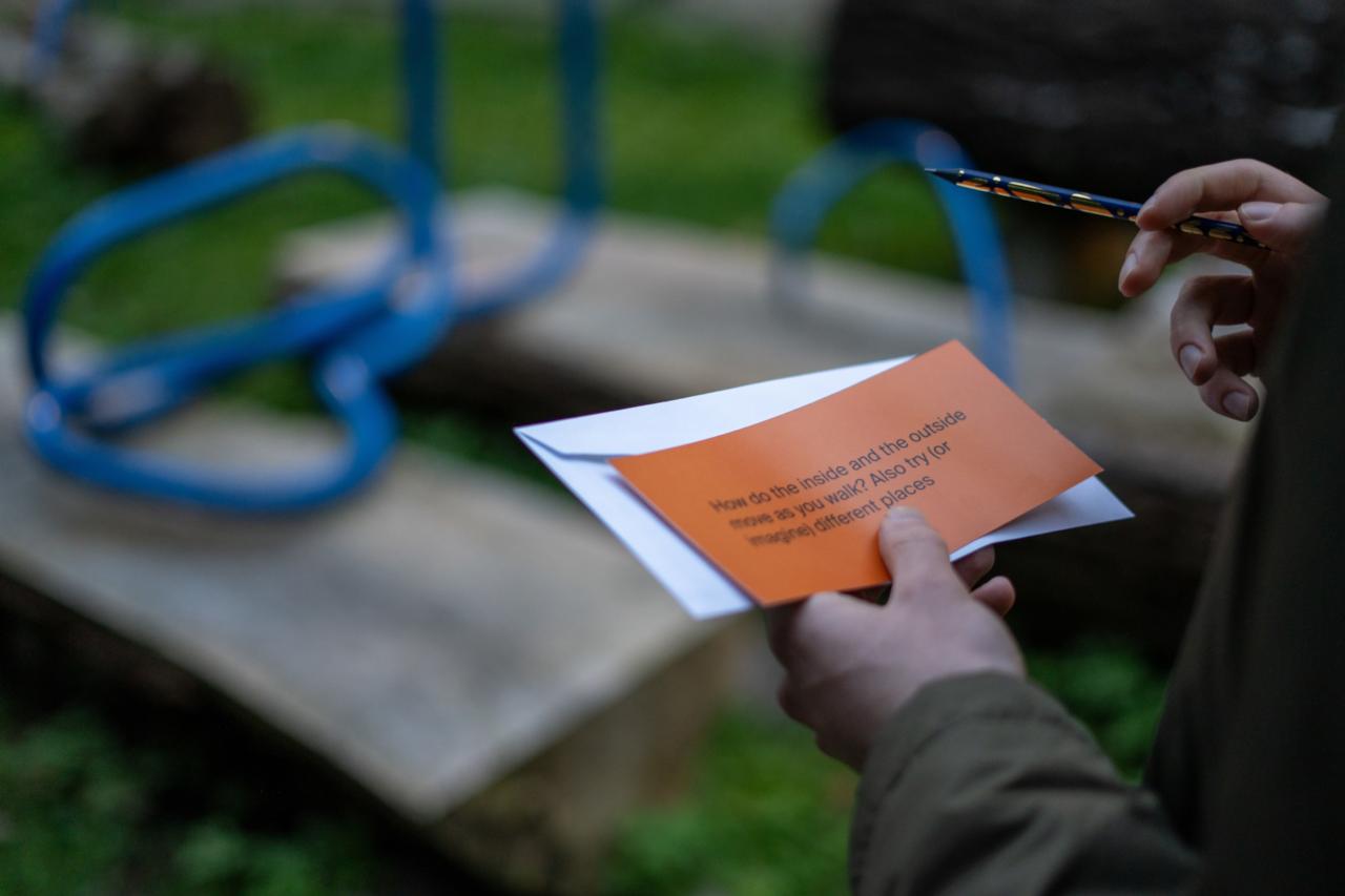 someone holding a question card